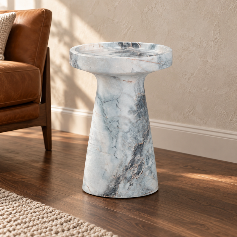 The Léandre Side Table styled in a refined contemporary interior, showing its realistic scale and material character in room context.