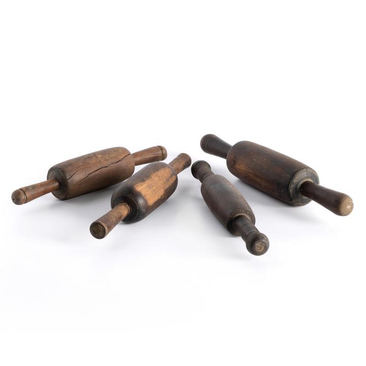 Full view of the Maya Chapati Roller Set showing four reclaimed wood rollers with varied brown tones and proportions.
