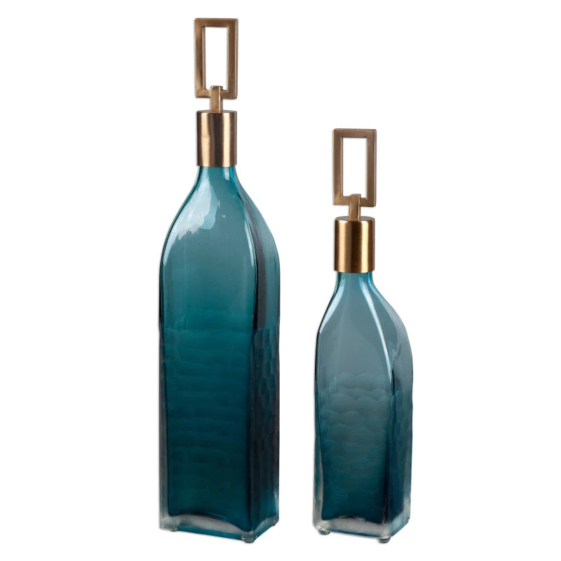 The Coralie Glass Bottle Set shown in a clean product view highlighting its textured teal glass & bronze stoppers.