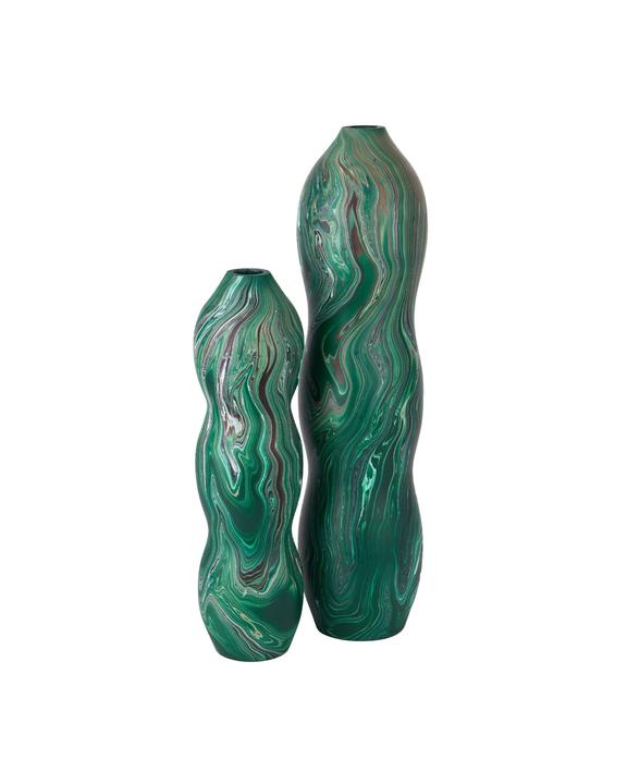 The Tamarind Green Vase with a tall seed-pod silhouette and dark-green marbleized wood surface.