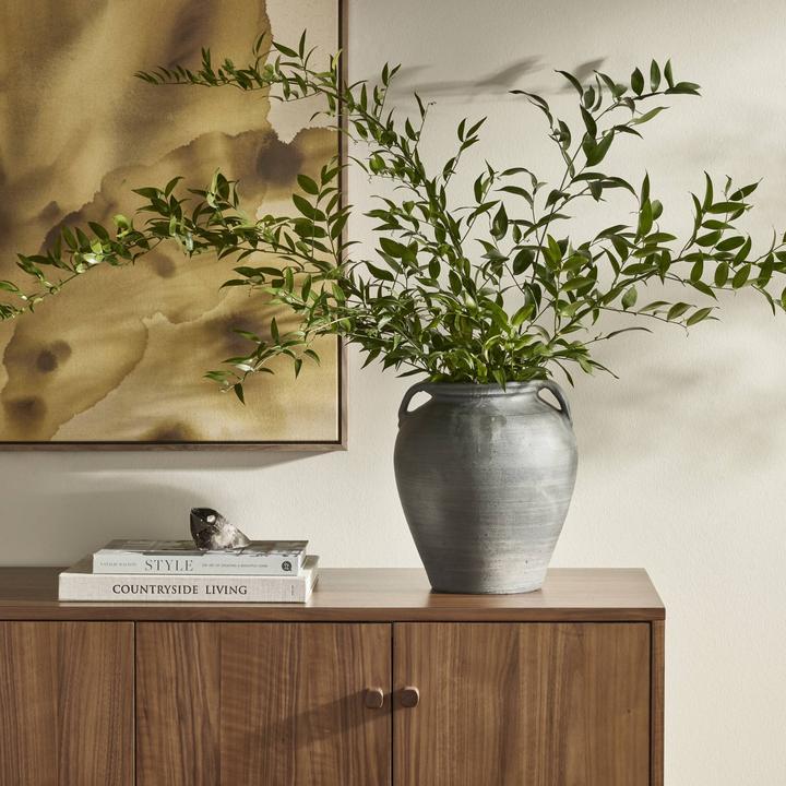 Angled view of the Coralie Terracotta Vessel highlighting the broad body and subtle handmade surface variation.