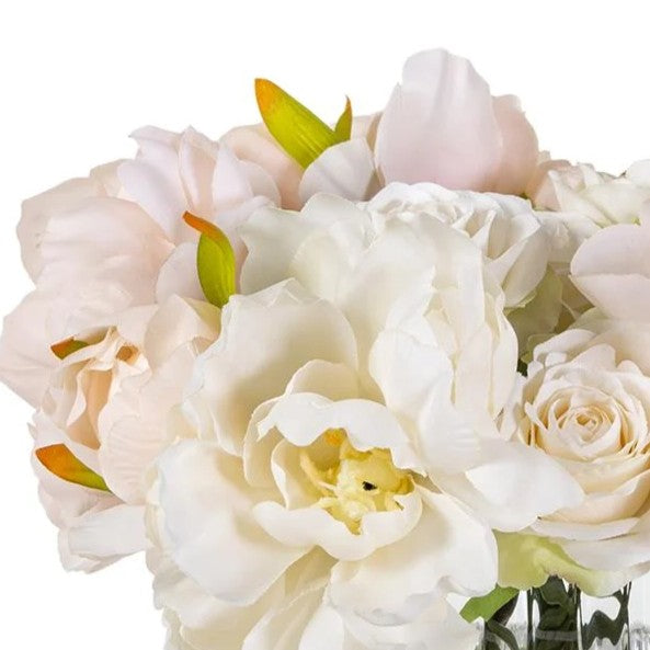 Close floral detail of Rosalie showing layered blush peonies, ivory roses, and pale green leaves.
