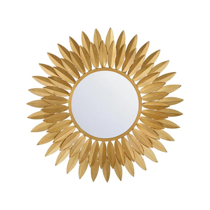 Detail view of the Broche Mirror highlighting the layered leaf-shaped steel elements.