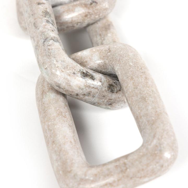 Angled view of the Marlow Marble Chain emphasizing the open negative space between the solid marble links.