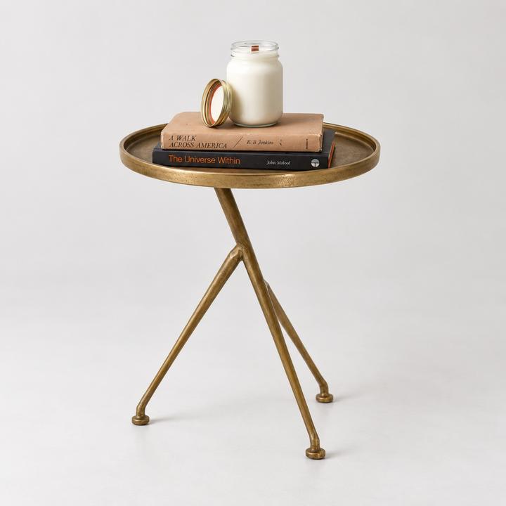 Angled view of the Arlette Tripod Accent Table emphasizing the asymmetrical three-leg construction.