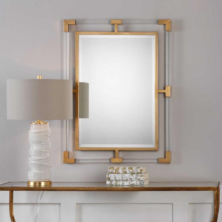 Second product view of the Gabrielle Mirror showing the interplay of gold iron and transparent acrylic.