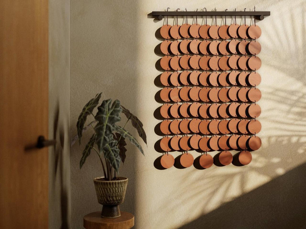 Alternate view of the Marlow Ceramic Wall Hanging showing the staggered disc layers and shallow dimensional profile.