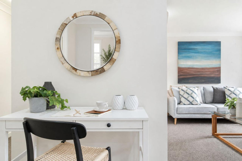 Detail view of the Godfrey Mirror highlighting cream, beige, ivory, and brown tonal variation in the horn.