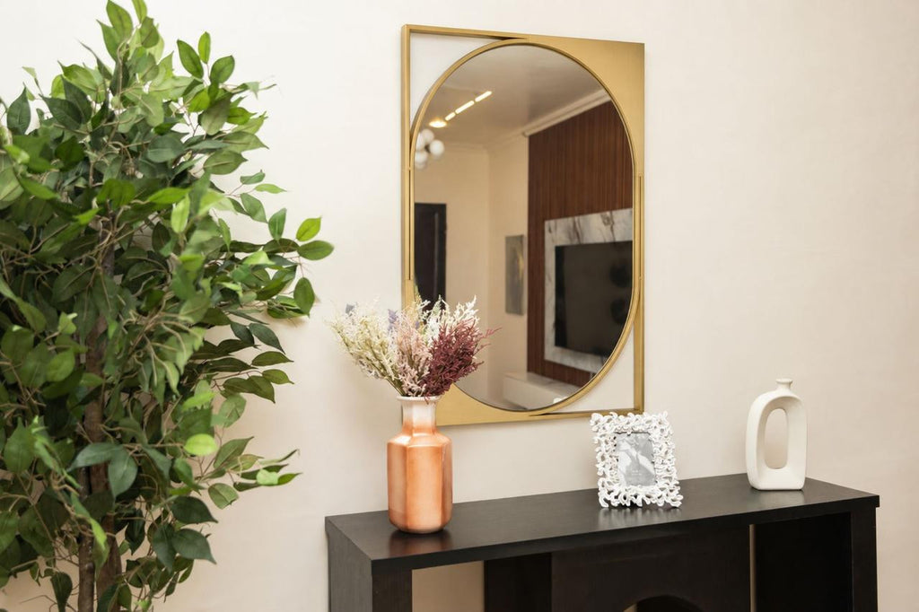 Detail view of the Diane Mirror emphasizing the hand-painted gold iron frame.