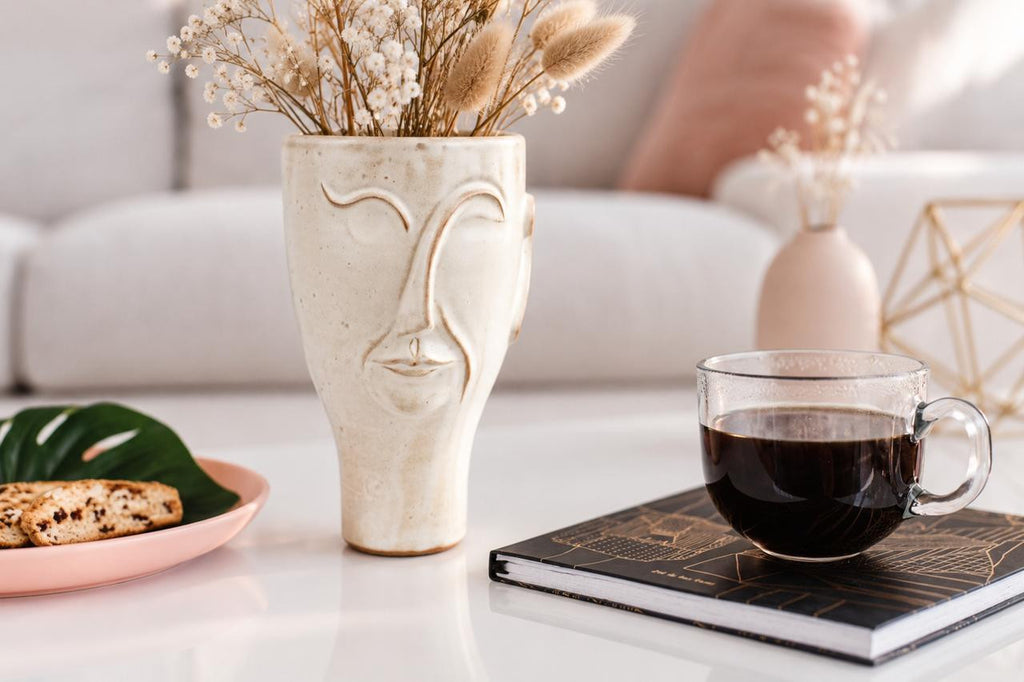 Additional view of the Poet Medium Vase emphasizing the abstract profile and milky white surface.