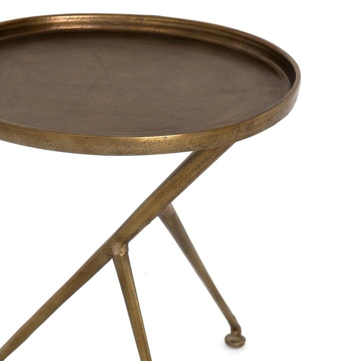 Close view of the Arlette Tripod Accent Table highlighting the angular cast-aluminum supports and off-center balance.