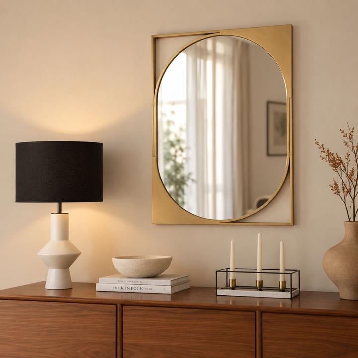 Additional product image of the Diane Mirror with reflective glass and restrained gold framing.