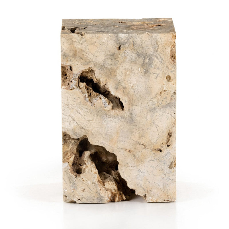 The Palu Accent Table shown from another angle, emphasizing the thickness and substantial mass of the solid travertine block.