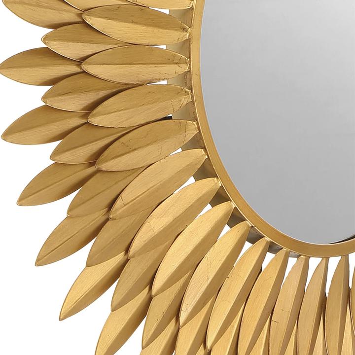 Additional view of the Broche Mirror and its repeated antique-gold steel leaf pattern.
