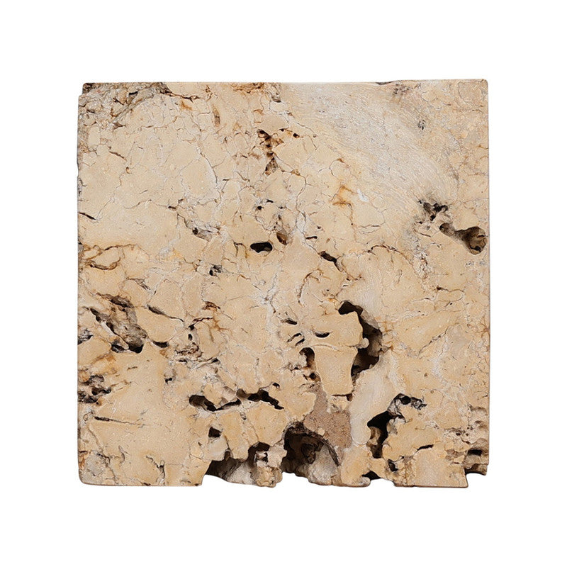 Detail-focused product view of The Palu Accent Table showing natural fissures, pitting, and irregular stone character.