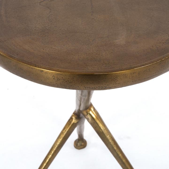 Alternate angle of the Arlette Tripod Accent Table showing the asymmetric metal geometry from another side.