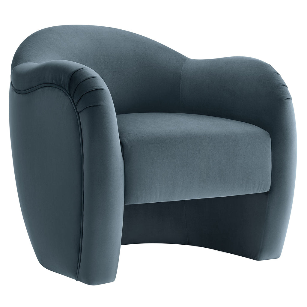 Storm-blue velvet barrel armchair with curved back and pleated arm detail, shown at a front angle