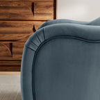 Close-up of French piping and hand-pleated fold detail on the arm of the Adeline Armchair