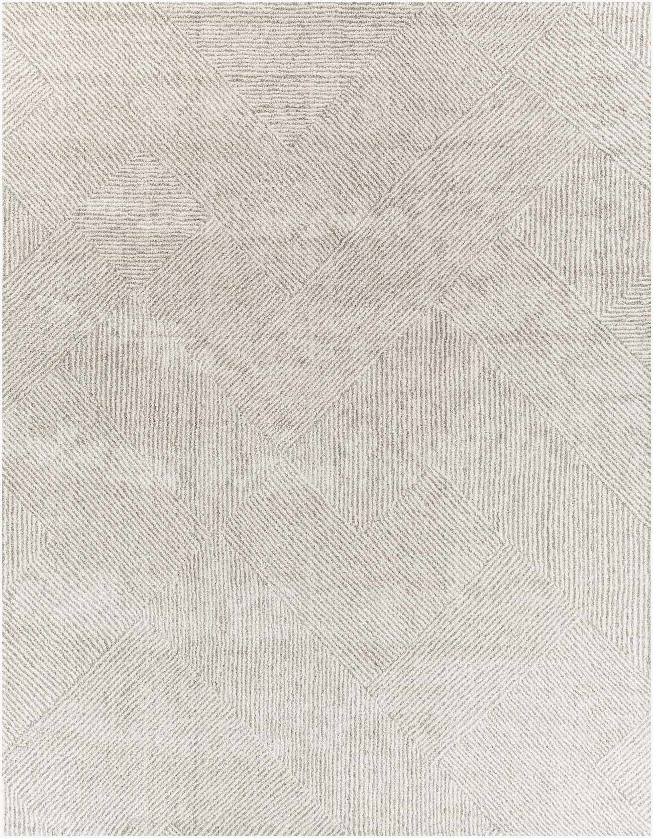 Close-up of tonal ivory and gray interlocking diamond weave pattern on high pile rug