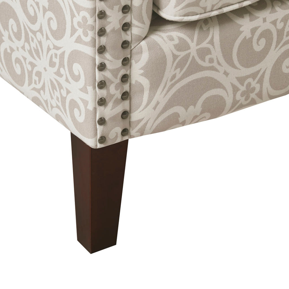 Close-up of the silver nailhead trim and espresso leg on the Anaïs Club Chair