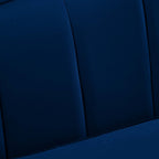 Macro detail of navy velvet channel tufting texture and stitched seams on the Bernadette Sofa's backrest