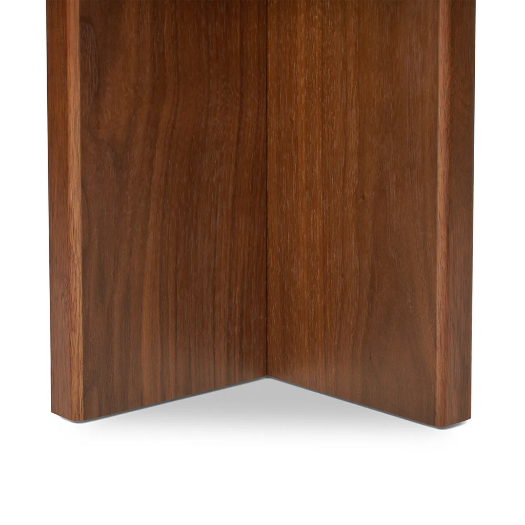 Close-up of the walnut cross-form base joint on the Coralie Side Table"