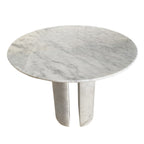 Corinne Dining Table, angled viewAngled view of round marble dining table showing twin curved marble legs and tabletop veining
