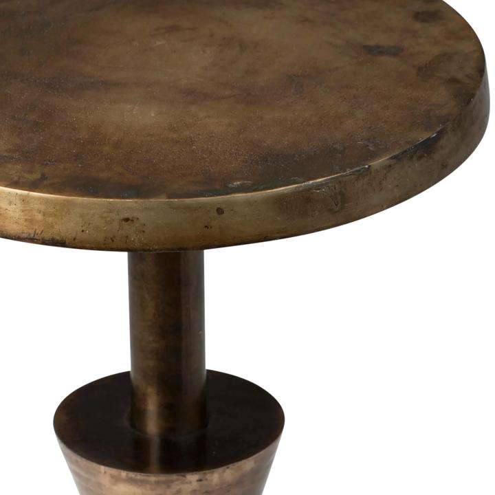 Product view of the Victoire Side Table highlighting the circular cast-aluminum top and stacked geometric pedestal.