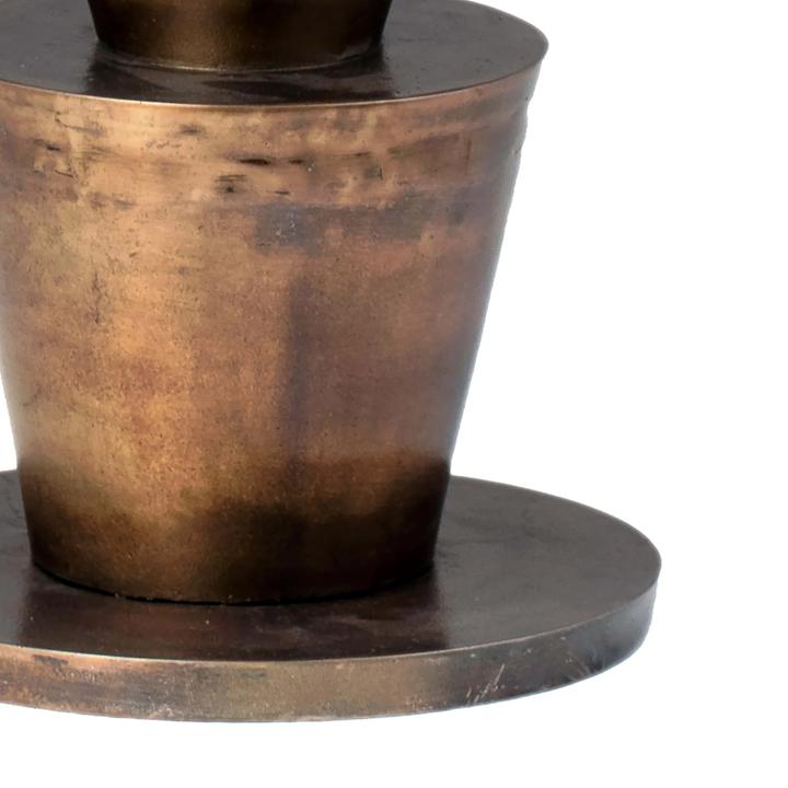 Detail view of the Victoire Side Table emphasizing the stacked tapered forms and antique-brass tonal variation.