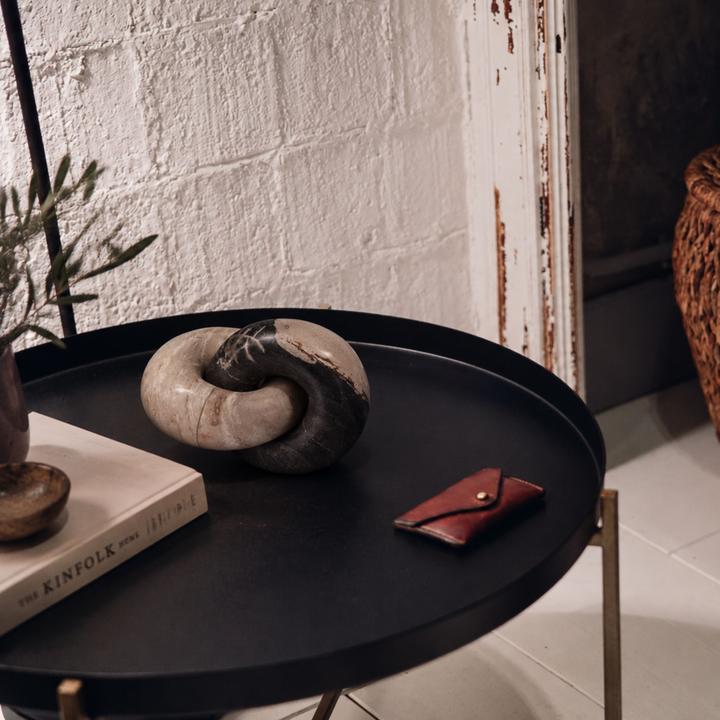 The Joëlle Petrified Wood Knot styled in a contemporary interior, showing its scale and material character in room context.