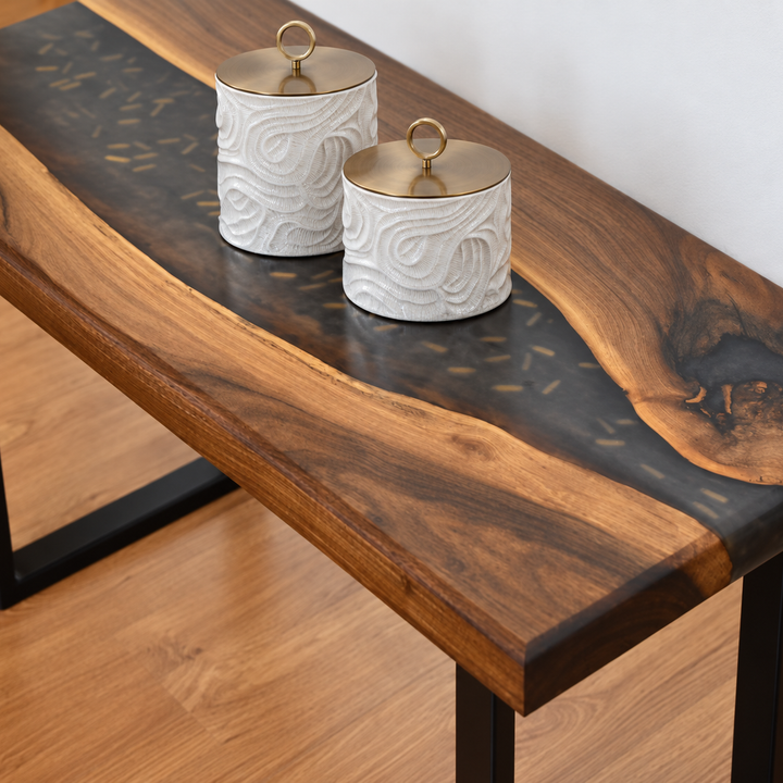 The Marée Canister Set styled in a refined contemporary interior, showing its realistic scale and material character in room context.