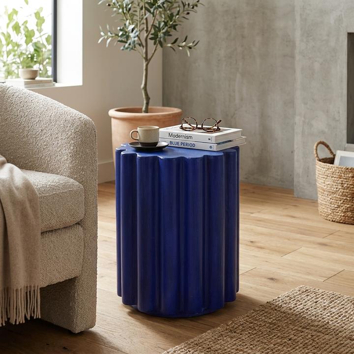 The Victoire Accent Table styled in a refined contemporary interior, showing its realistic scale and material character in room context.
