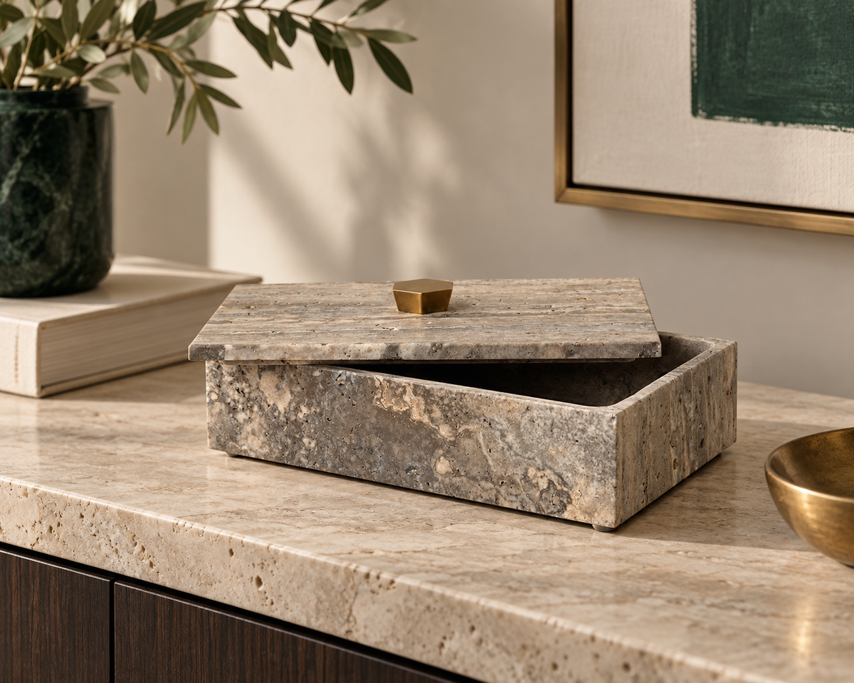 The Augustin Travertine Box in a second editorial interior setting, showing the piece in relation to surrounding furnishings.