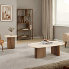 The Elodie End Table and matching Elodie Coffee Table together in a living room, showing the shared travertine and oak design.