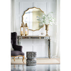 Gold scalloped sunburst mirror shown in full against a white background