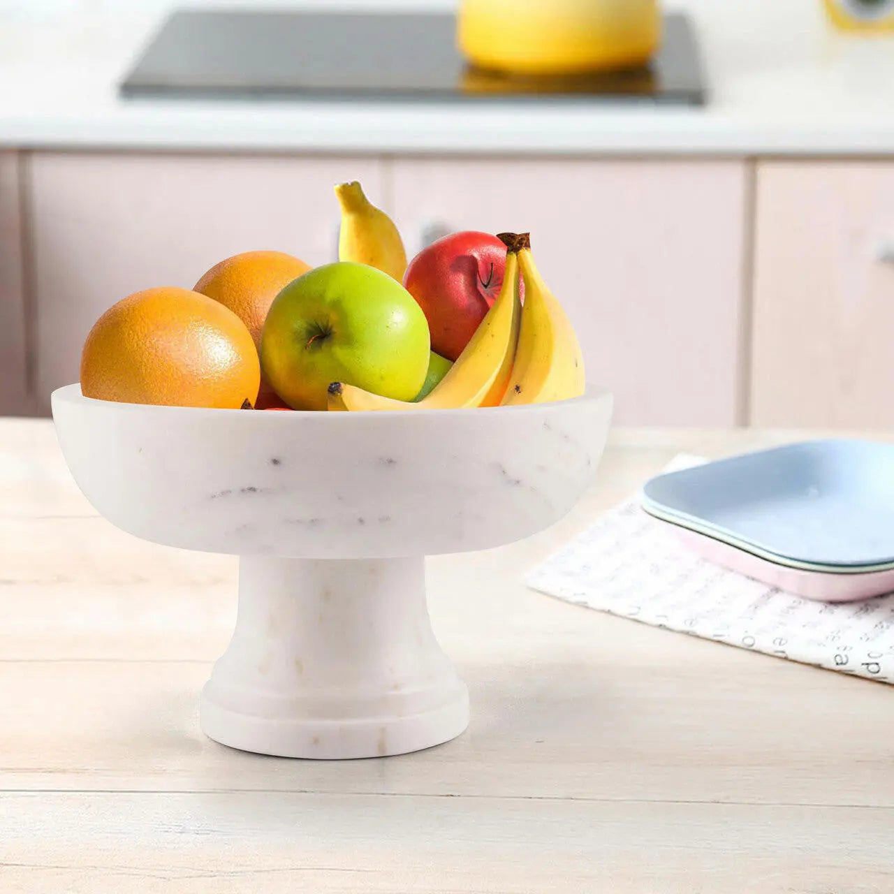 The Geneviève Pedestal Bowl — Natural Marble — giselle marble fruit bowl kitchen