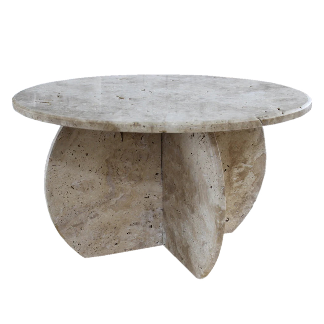 Round travertine coffee table with curved intersecting stone base, shown at a front angle