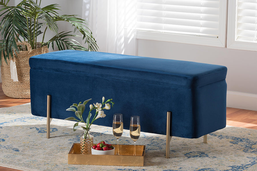 Navy velvet Lina Storage Bench styled in a living room with a woven planter, area rug, and gold serving tray