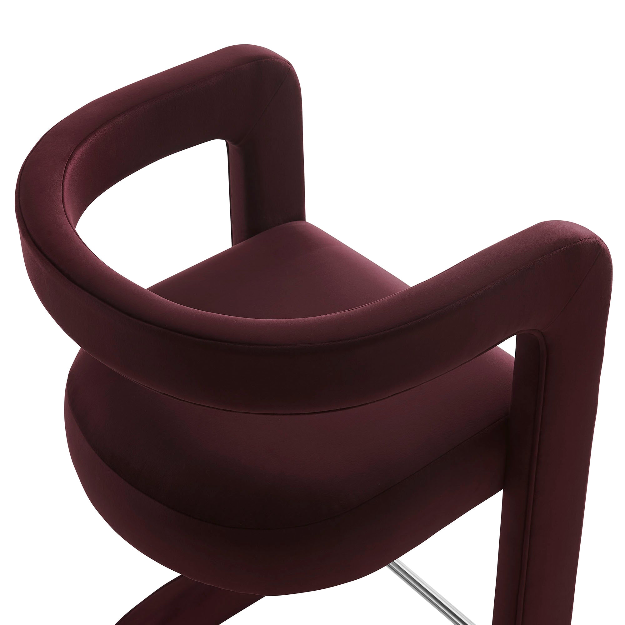 Close-up of the continuous curved backrest and armrest line on the Margot Counter Stool