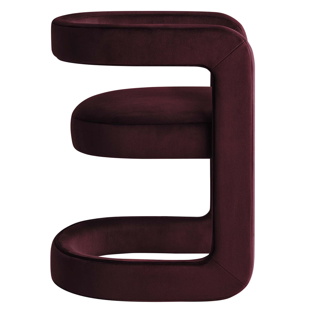 Side view of the Margot Dining Chair showing the continuous curved open backrest in aubergine velvet
