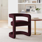 Aubergine velvet dining chair styled beside a bookshelf and side table