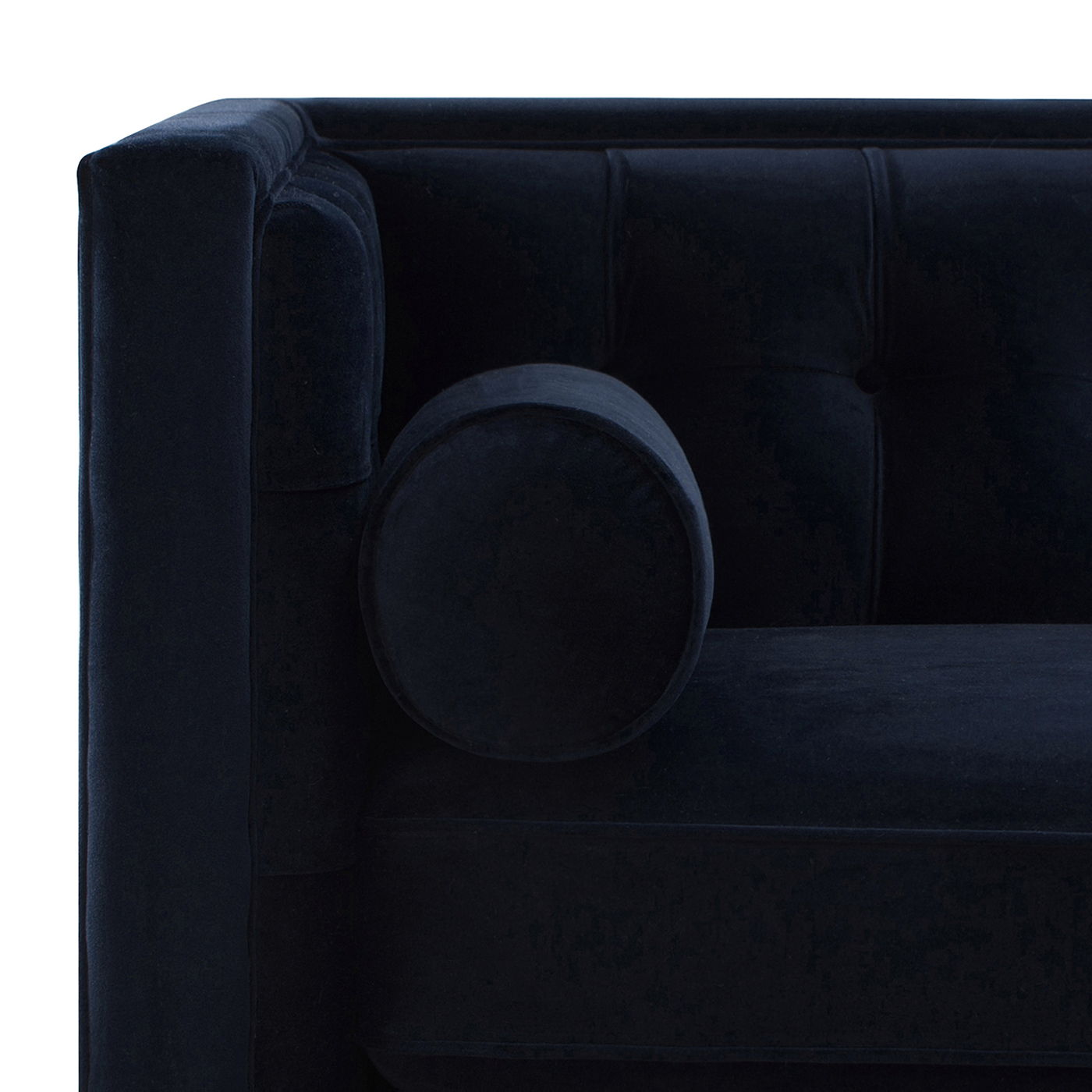 Minimalist 84-inch sofa from the Cadence collection featuring a crisp tuxedo silhouette and tapered accent legs in dark navy . Arm and seat detail