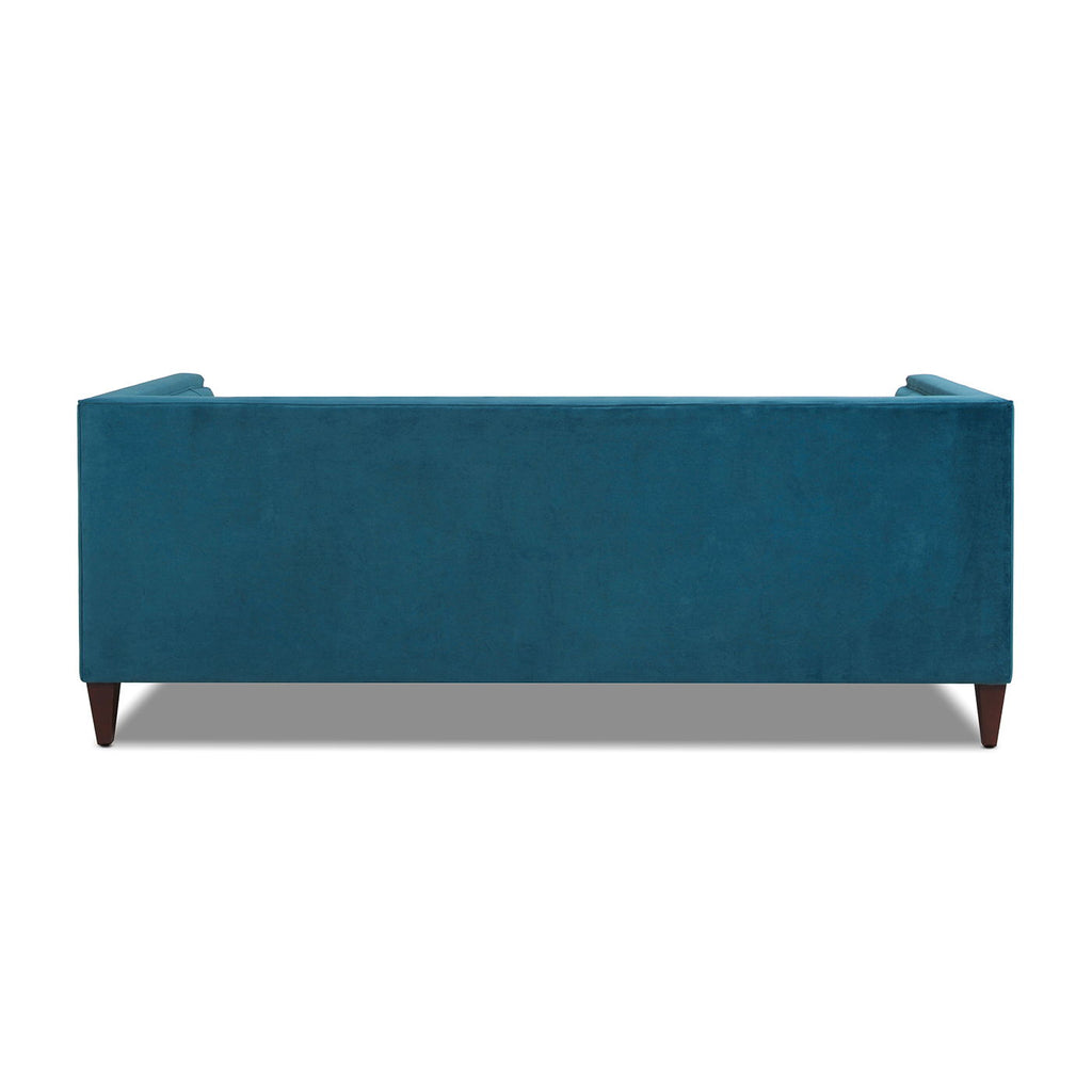 Minimalist 84-inch sofa from the Cadence collection featuring a crisp tuxedo silhouette and tapered accent legs in teal blue.Back vies