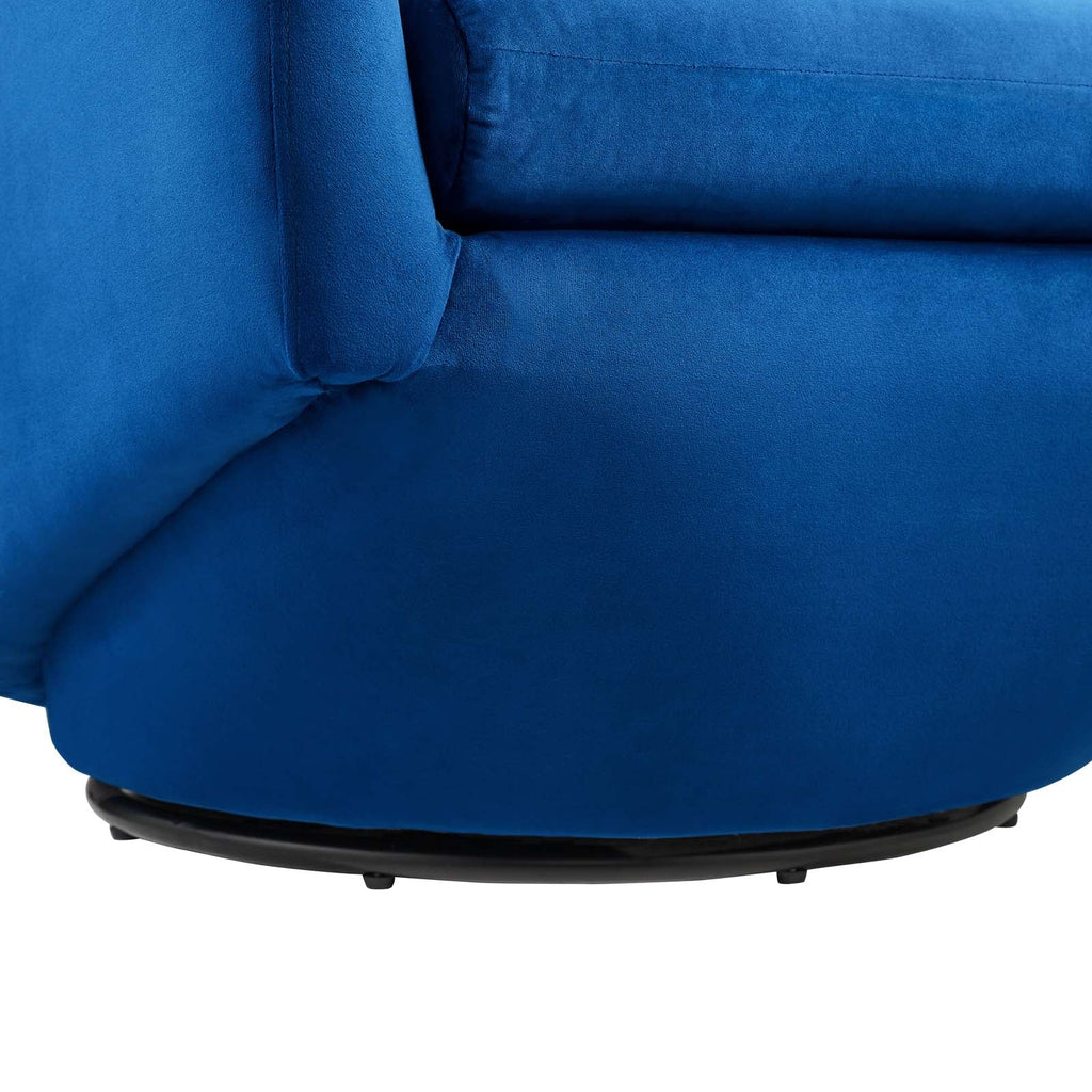 Close-up of the matte black swivel base beneath the Noelle Swivel Chair's navy velvet upholstery