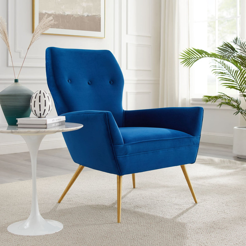 Navy velvet tufted armchair styled beside a modern reading corner