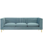 Light blue channel-tufted velvet sofa with brushed gold legs, shown straight-on