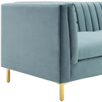 Close-up of the brushed gold leg and corner detail on the Roxane Sofa