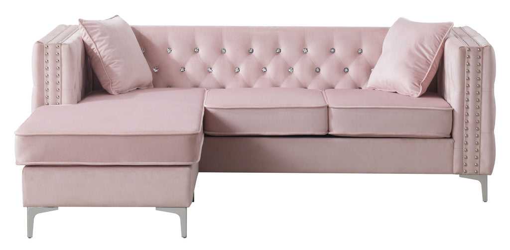 Blush pink velvet sofa chaise shown at a front angle showing the reversible chaise configuration