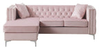 Blush pink velvet sofa chaise shown at a front angle showing the reversible chaise configuration