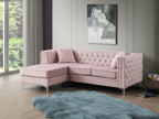 Blush pink velvet sofa chaise with crystal tufting and nailhead trim, styled in a modern living room
